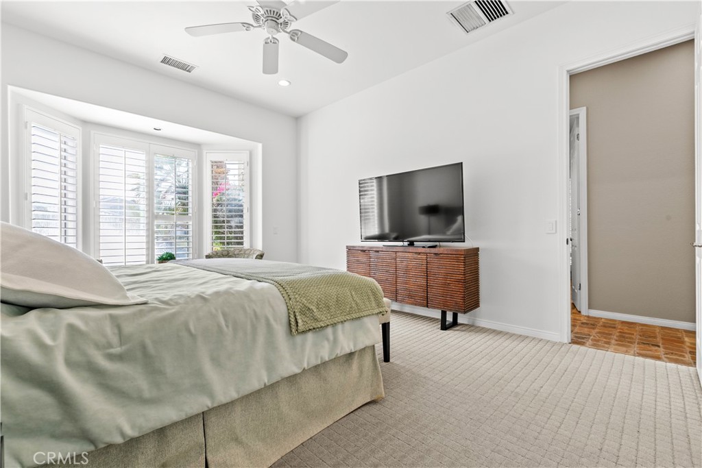 44 Killian Way Rancho Mirage, CA 92270 - Photo 46 of 72 a bedroom with a bed and a flat screen tv