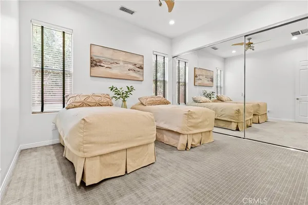 an aerial view of a residential houses with yard