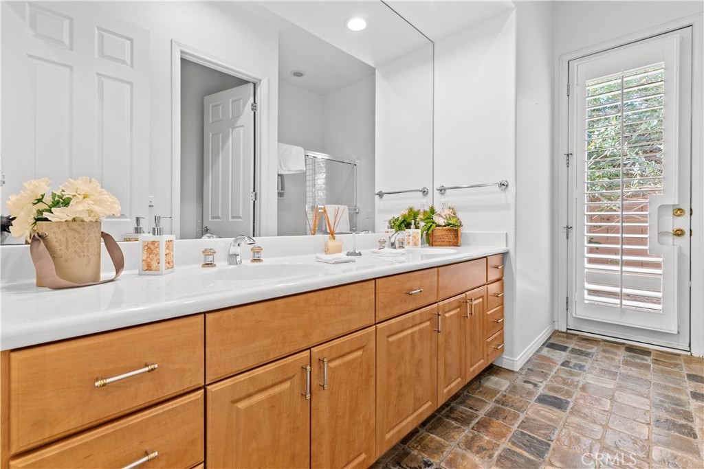 44 Killian Way Rancho Mirage, CA 92270 - Photo 51 of 72 a bathroom with a sink and a mirror