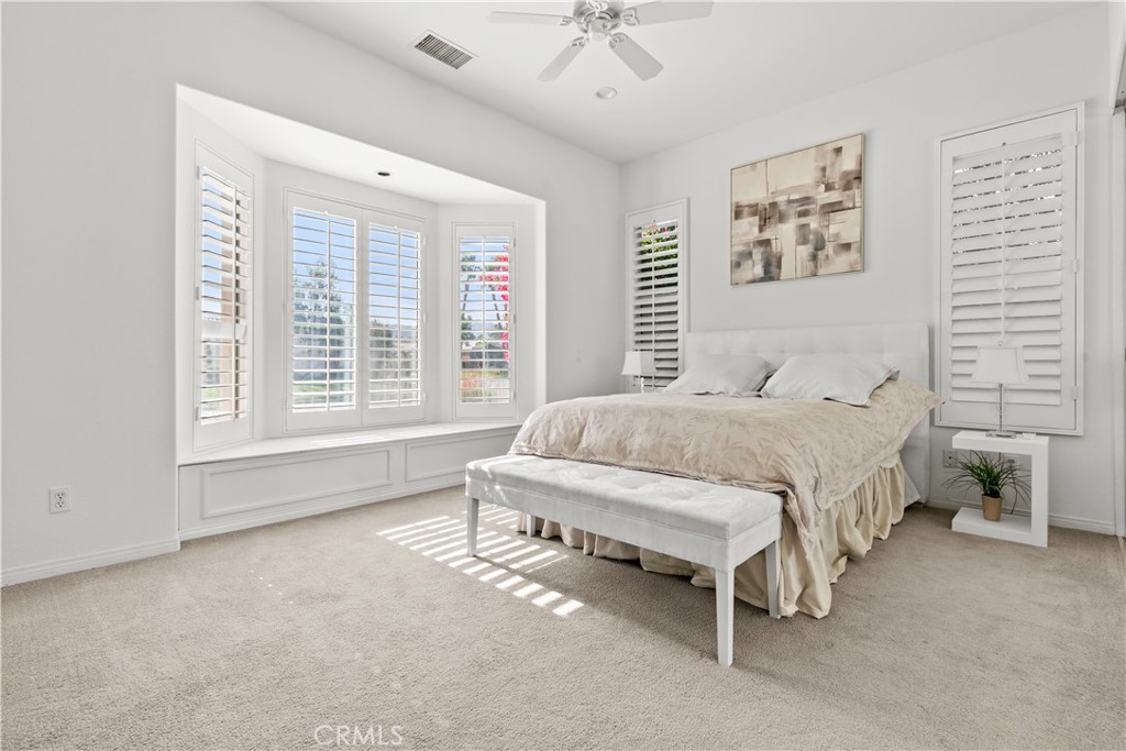 44 Killian Way Rancho Mirage, CA 92270 - Photo 53 of 72 a spacious bedroom with a bed and a large window