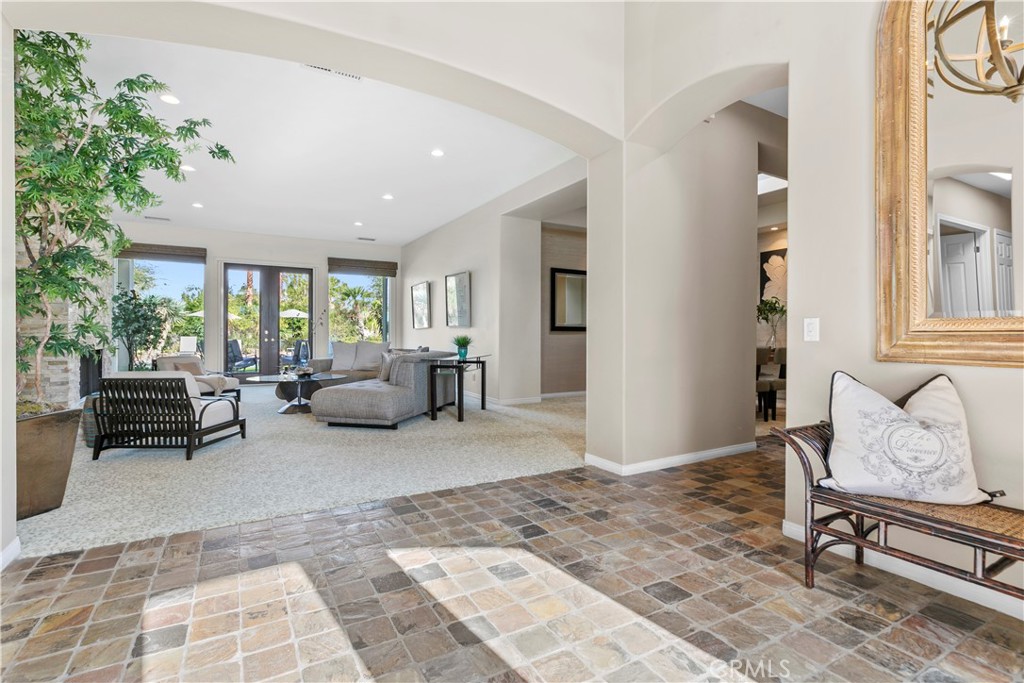 44 Killian Way Rancho Mirage, CA 92270 - Photo 6 of 72 a living room with furniture and a potted plant