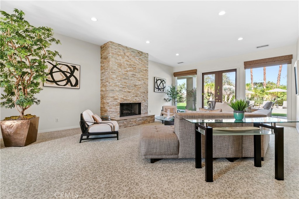 44 Killian Way Rancho Mirage, CA 92270 - Photo 7 of 72 a living room with furniture and a fireplace