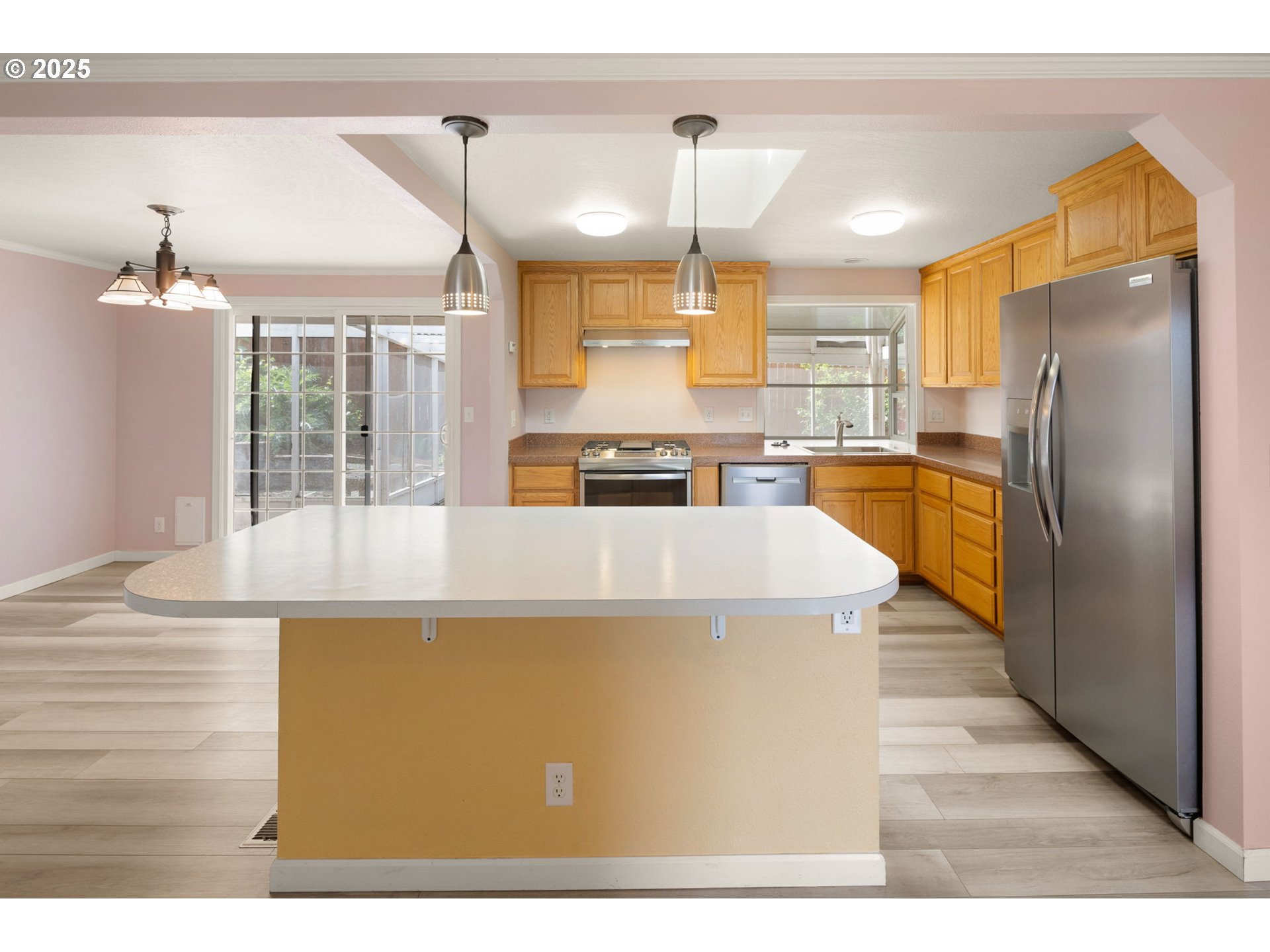 2730 Malibu Way Eugene, OR 97405 - Photo 11 of 47 a kitchen with stainless steel appliances granite countertop a refrigerator a oven a stove and a sink