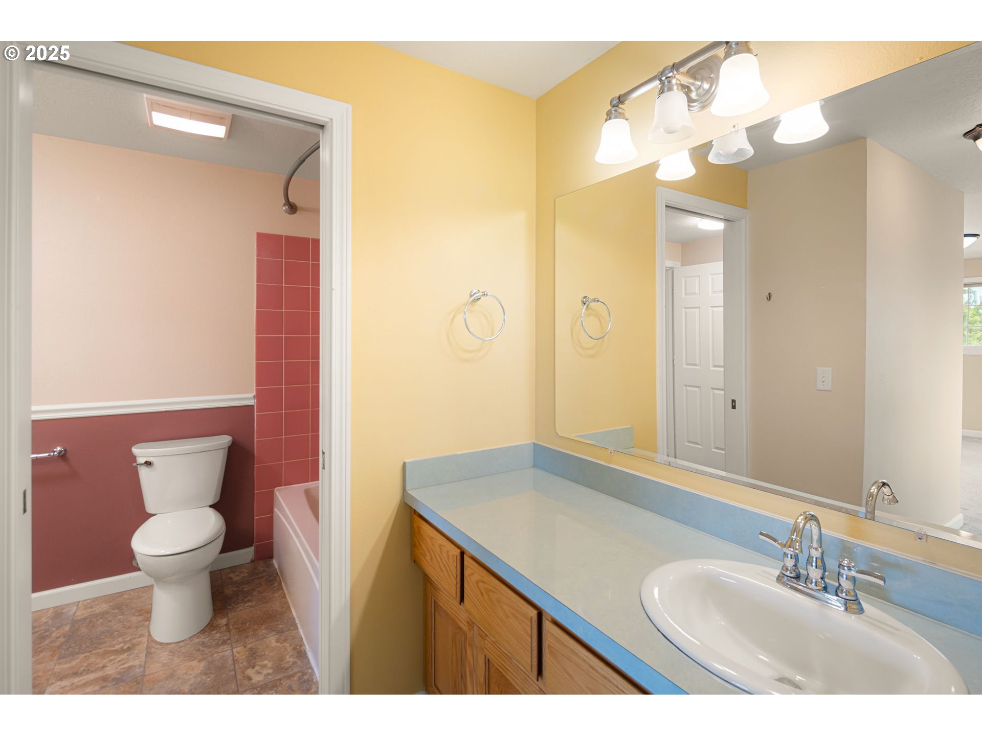 2730 Malibu Way Eugene, OR 97405 - Photo 25 of 47 a bathroom with a granite countertop sink and a mirror