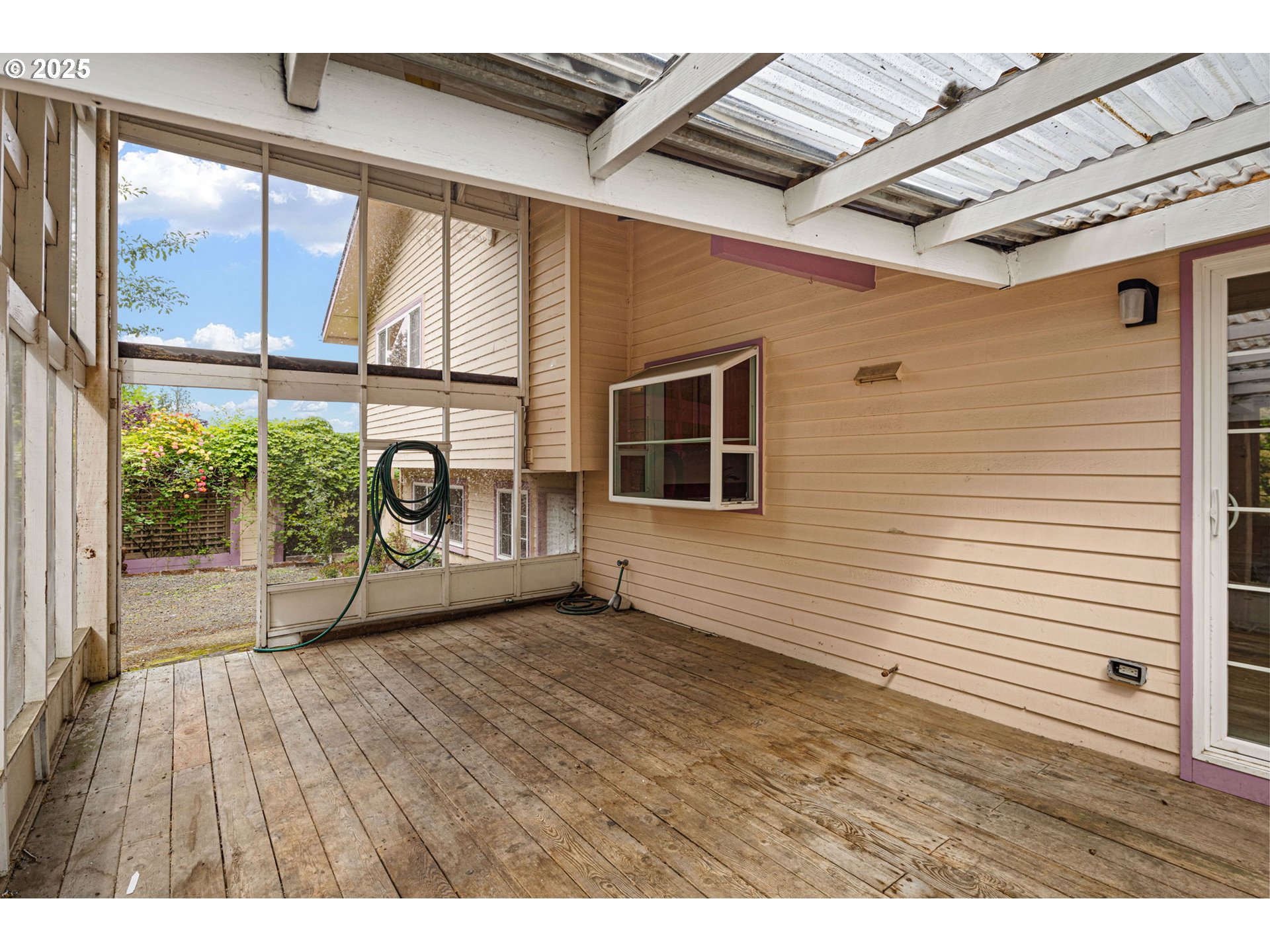 2730 Malibu Way Eugene, OR 97405 - Photo 40 of 47 a view of an empty room with a window and wooden floor