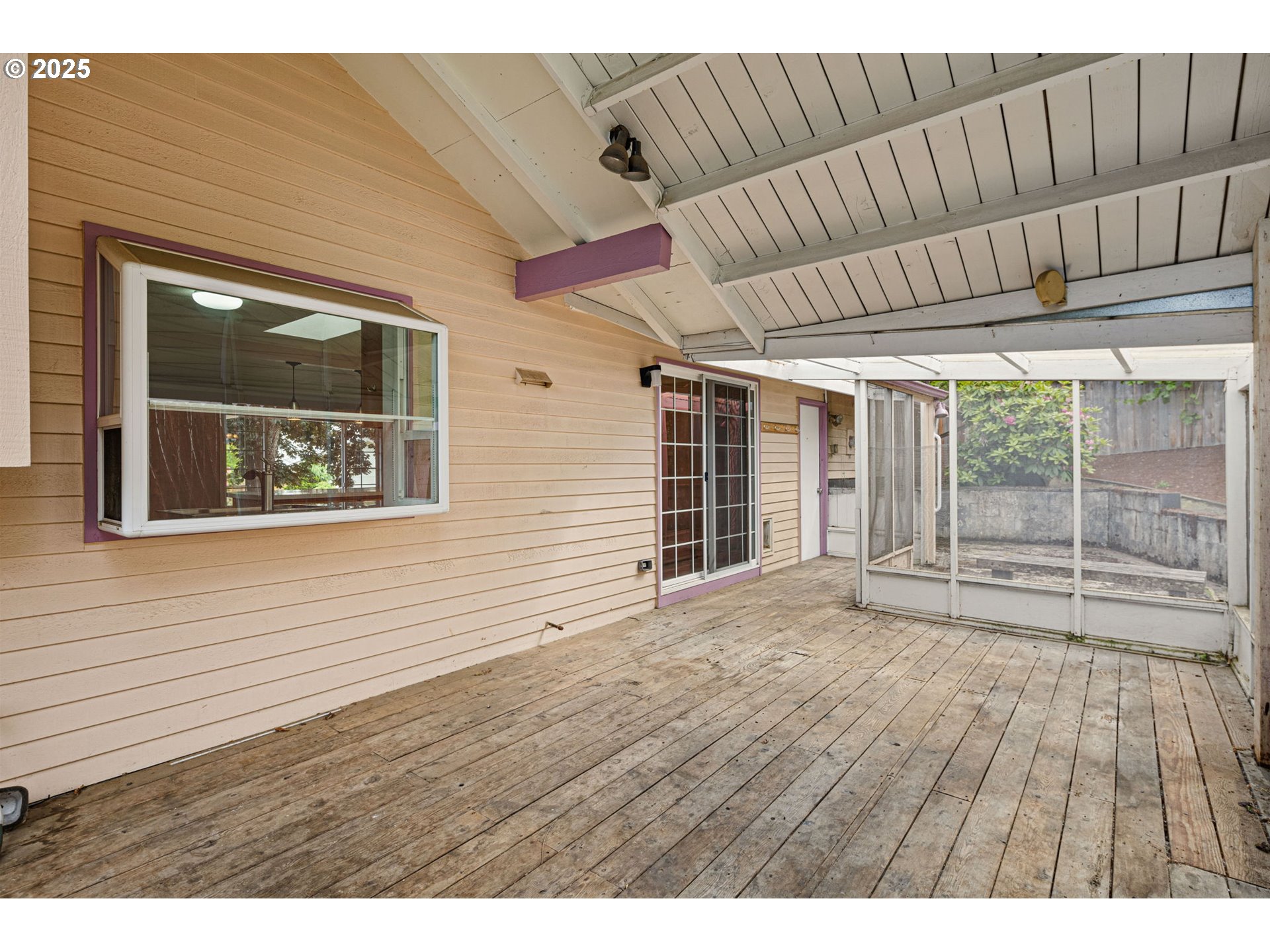 2730 Malibu Way Eugene, OR 97405 - Photo 41 of 47 a view of an empty room with wooden floor and a window