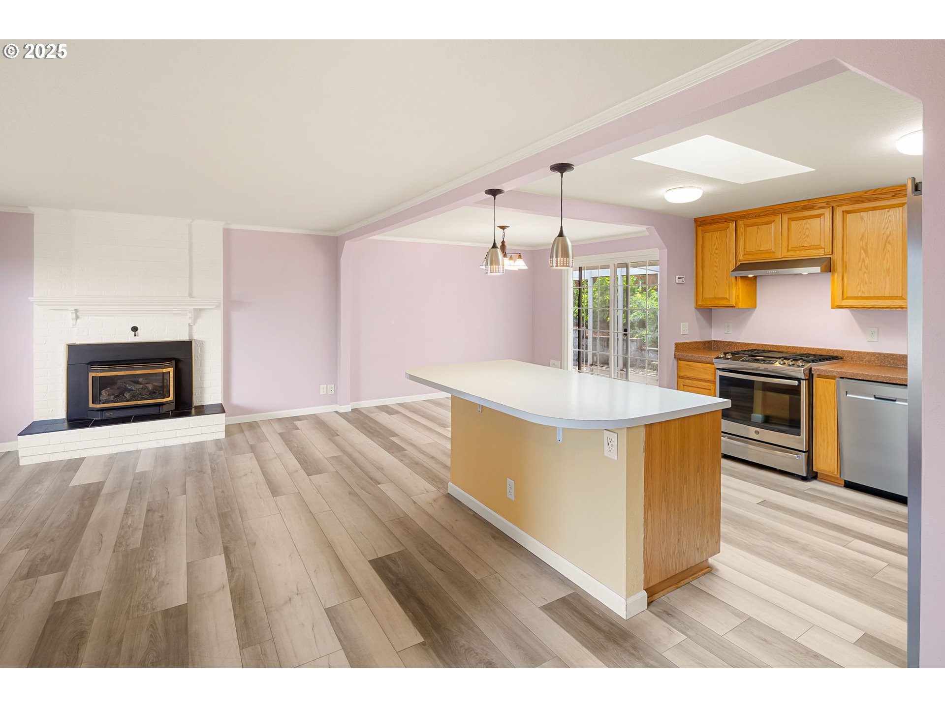 2730 Malibu Way Eugene, OR 97405 - Photo 8 of 47 a kitchen with stainless steel appliances a stove top oven and sink
