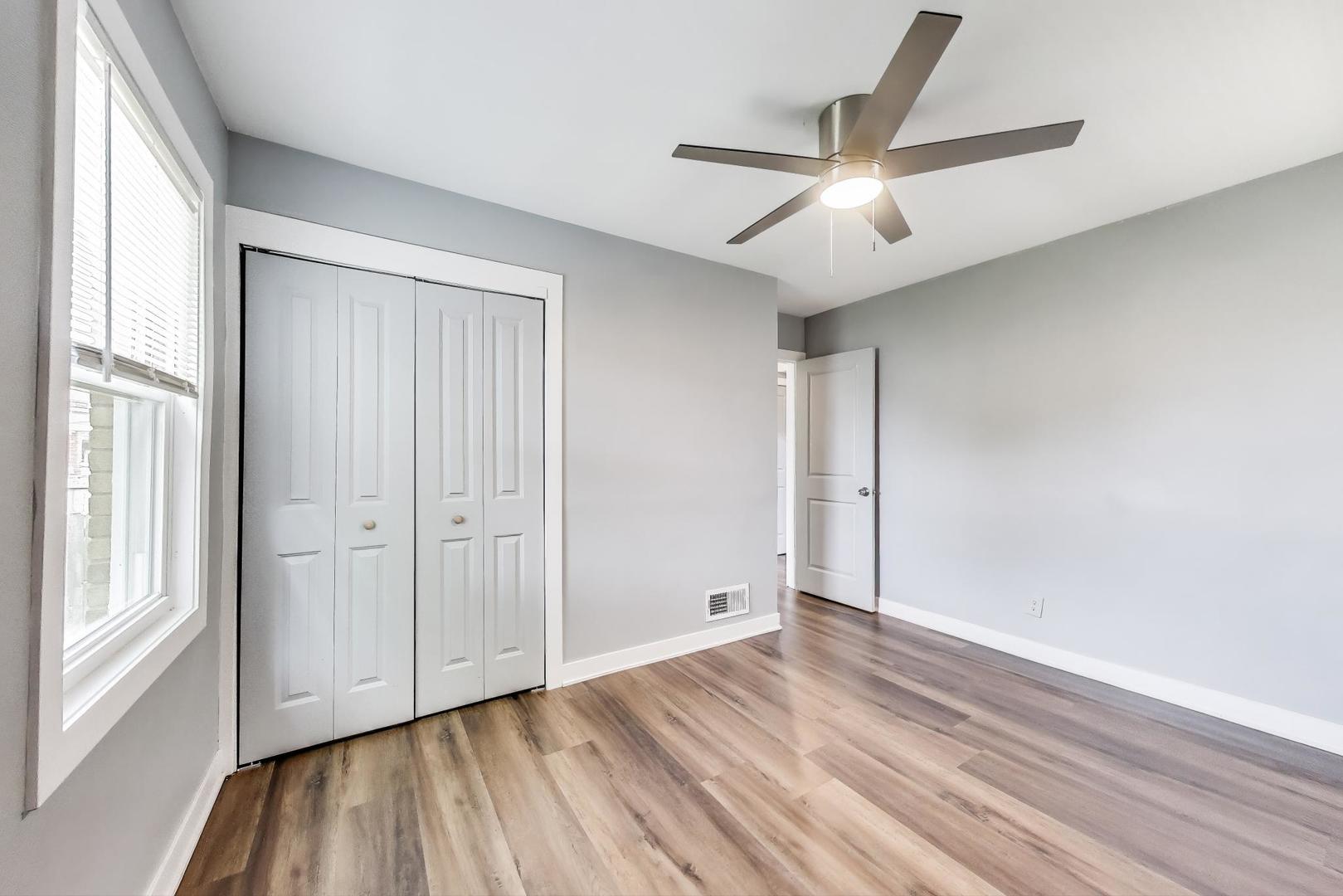 4118 Prairie Avenue Brookfield, IL 60513 - Photo 16 of 43 wooden floor in an empty room with a window