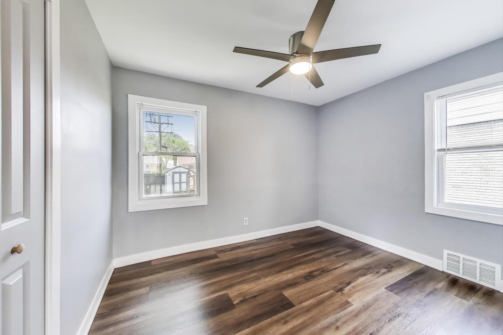 4118 Prairie Avenue Brookfield, IL 60513 - Photo 17 of 43 wooden floor in an empty room with a window
