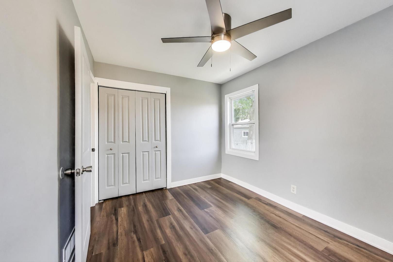 4118 Prairie Avenue Brookfield, IL 60513 - Photo 18 of 43 wooden floor in an empty room with a window