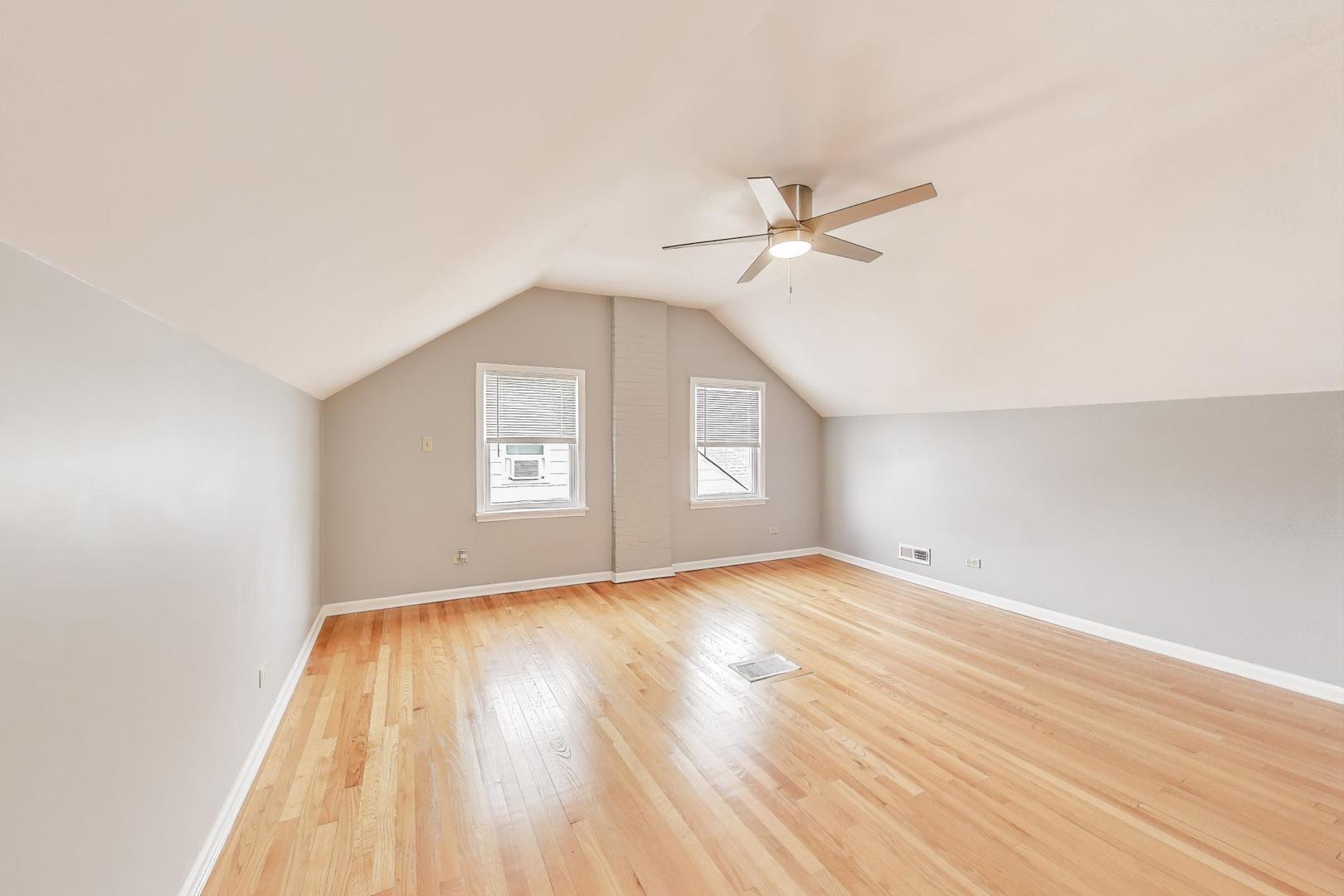 4118 Prairie Avenue Brookfield, IL 60513 - Photo 22 of 43 a view of empty room with wooden floor and fan