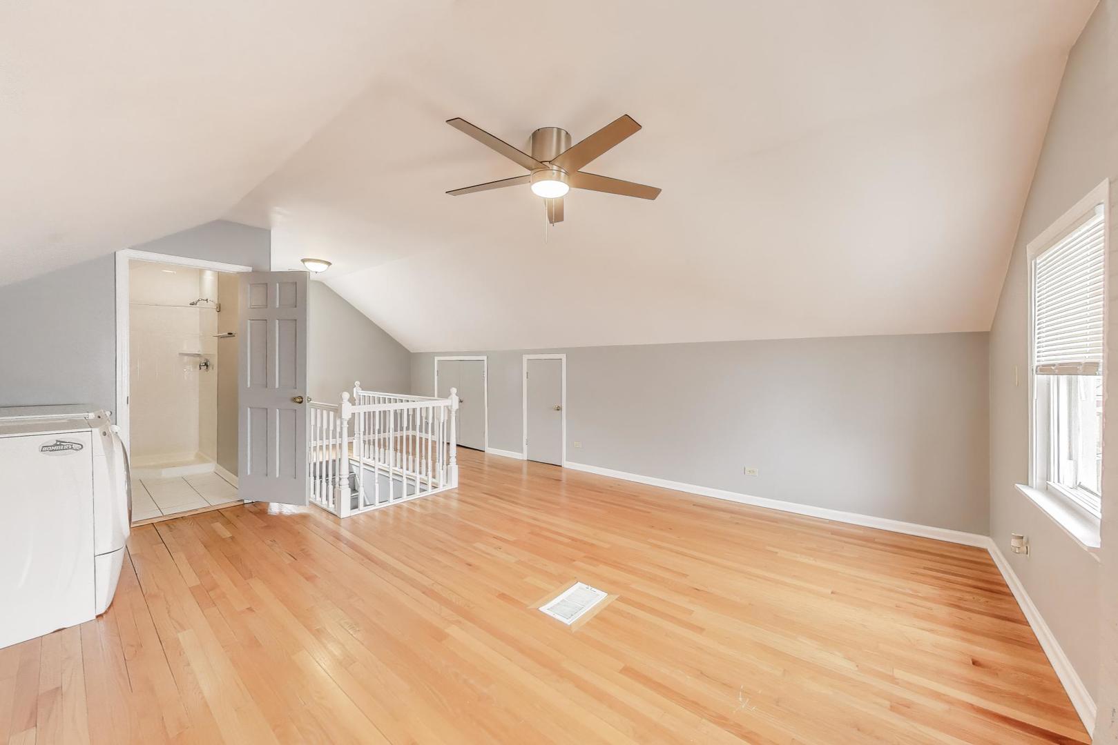 4118 Prairie Avenue Brookfield, IL 60513 - Photo 24 of 43 a view of a livingroom with a window and a ceiling fan