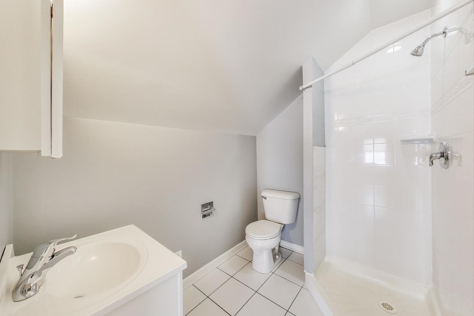 4118 Prairie Avenue Brookfield, IL 60513 - Photo 25 of 43 a bathroom with a sink toilet and shower