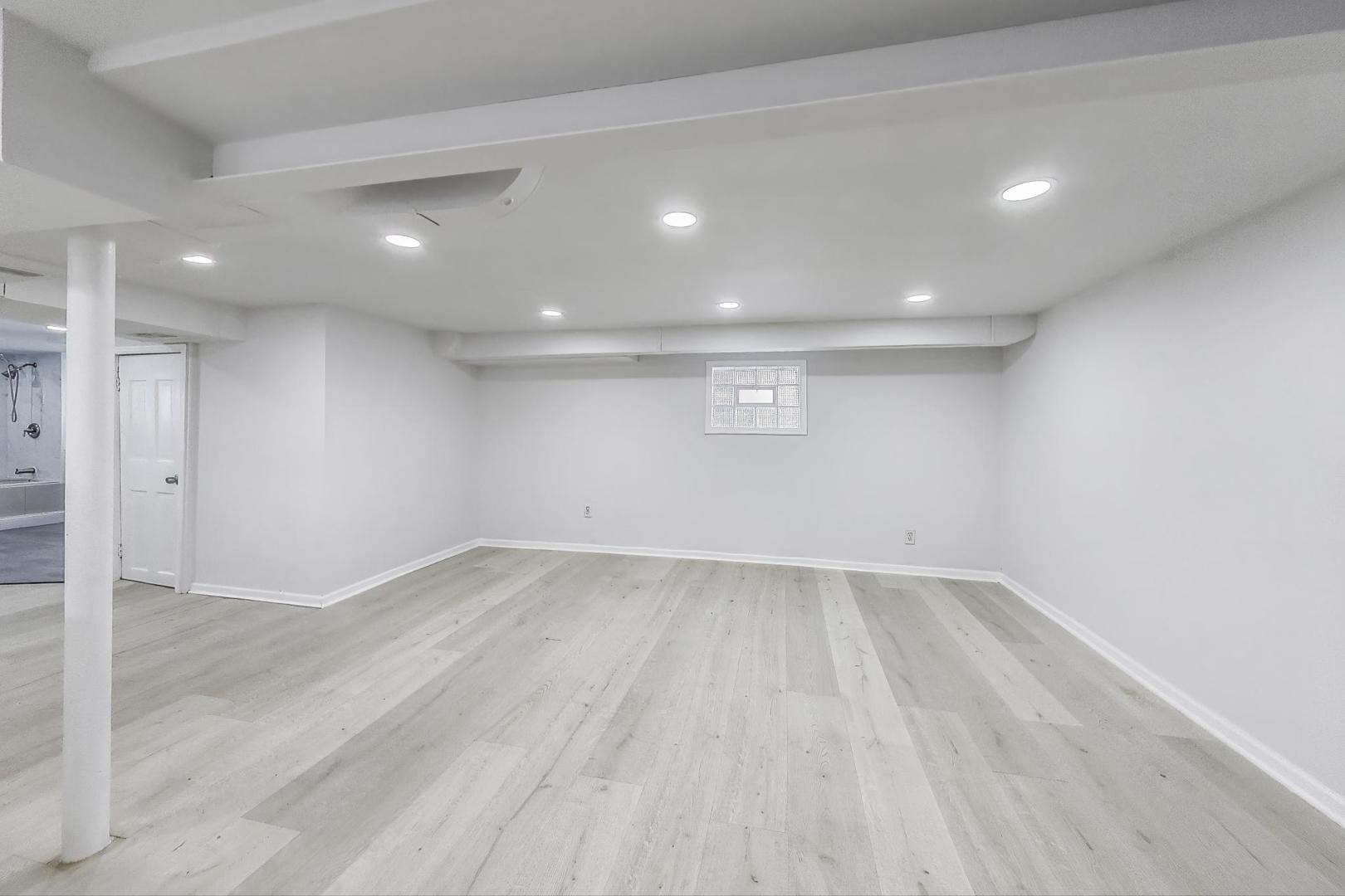 4118 Prairie Avenue Brookfield, IL 60513 - Photo 28 of 43 an empty room with wooden floor and windows