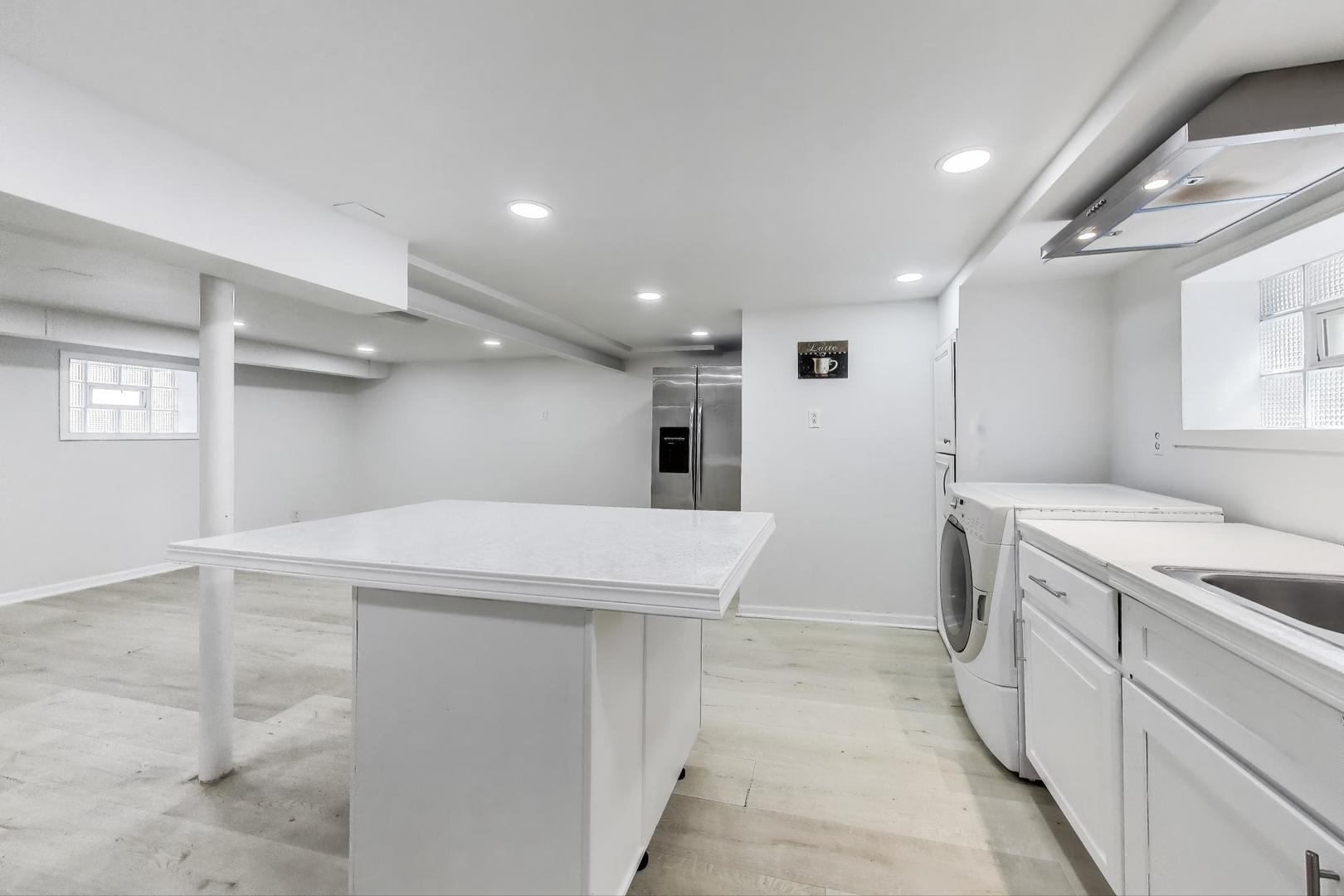 4118 Prairie Avenue Brookfield, IL 60513 - Photo 29 of 43 a kitchen with a sink and a refrigerator