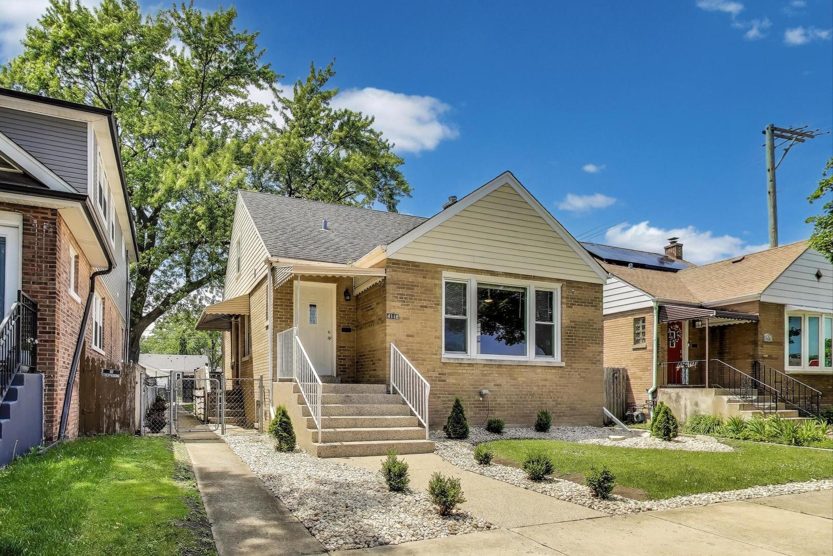 4118 Prairie Avenue Brookfield, IL 60513 - Photo 3 of 43 a front view of a house with a yard and garage