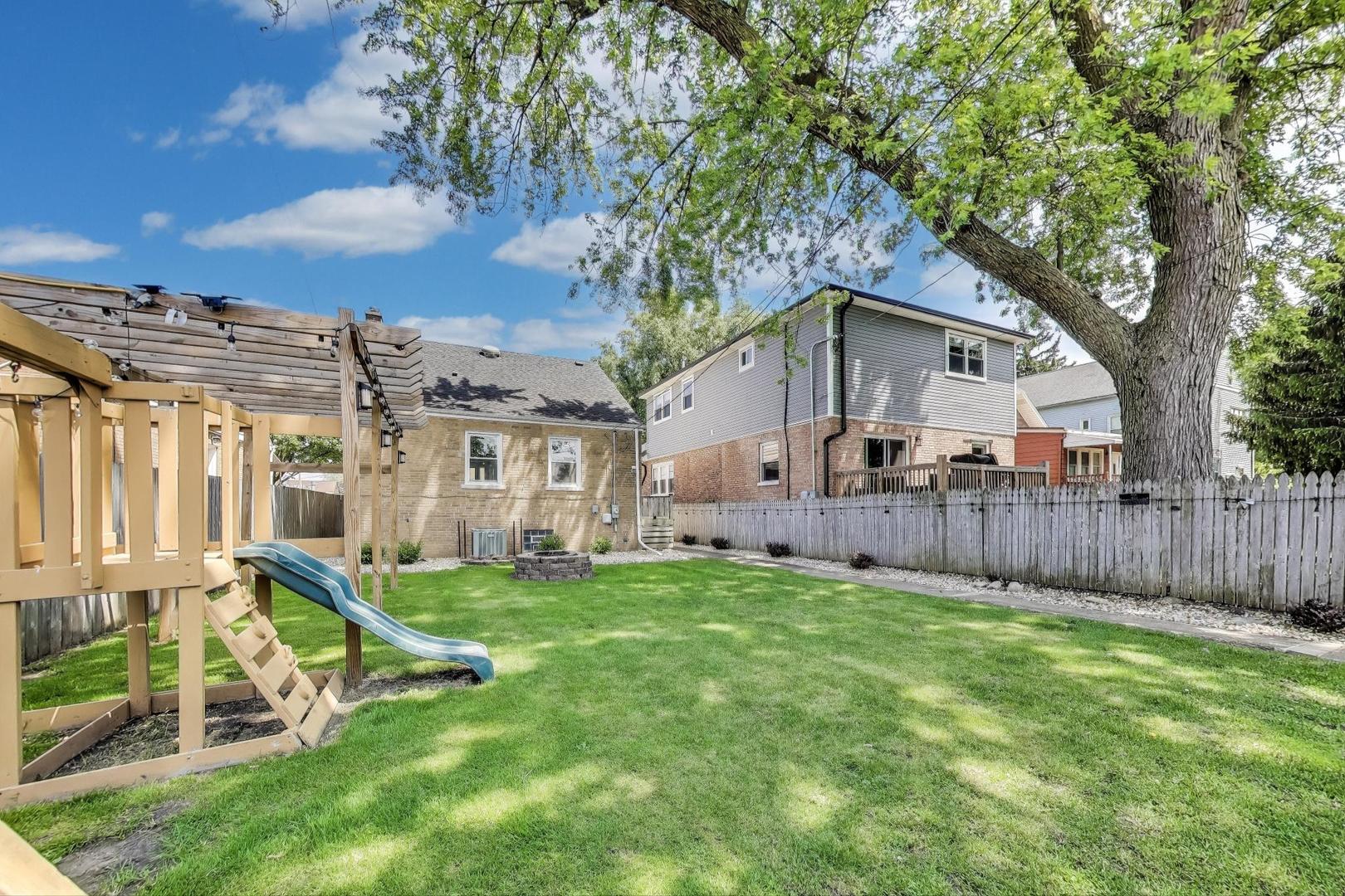 4118 Prairie Avenue Brookfield, IL 60513 - Photo 38 of 43 a view of a house with a yard and sitting area
