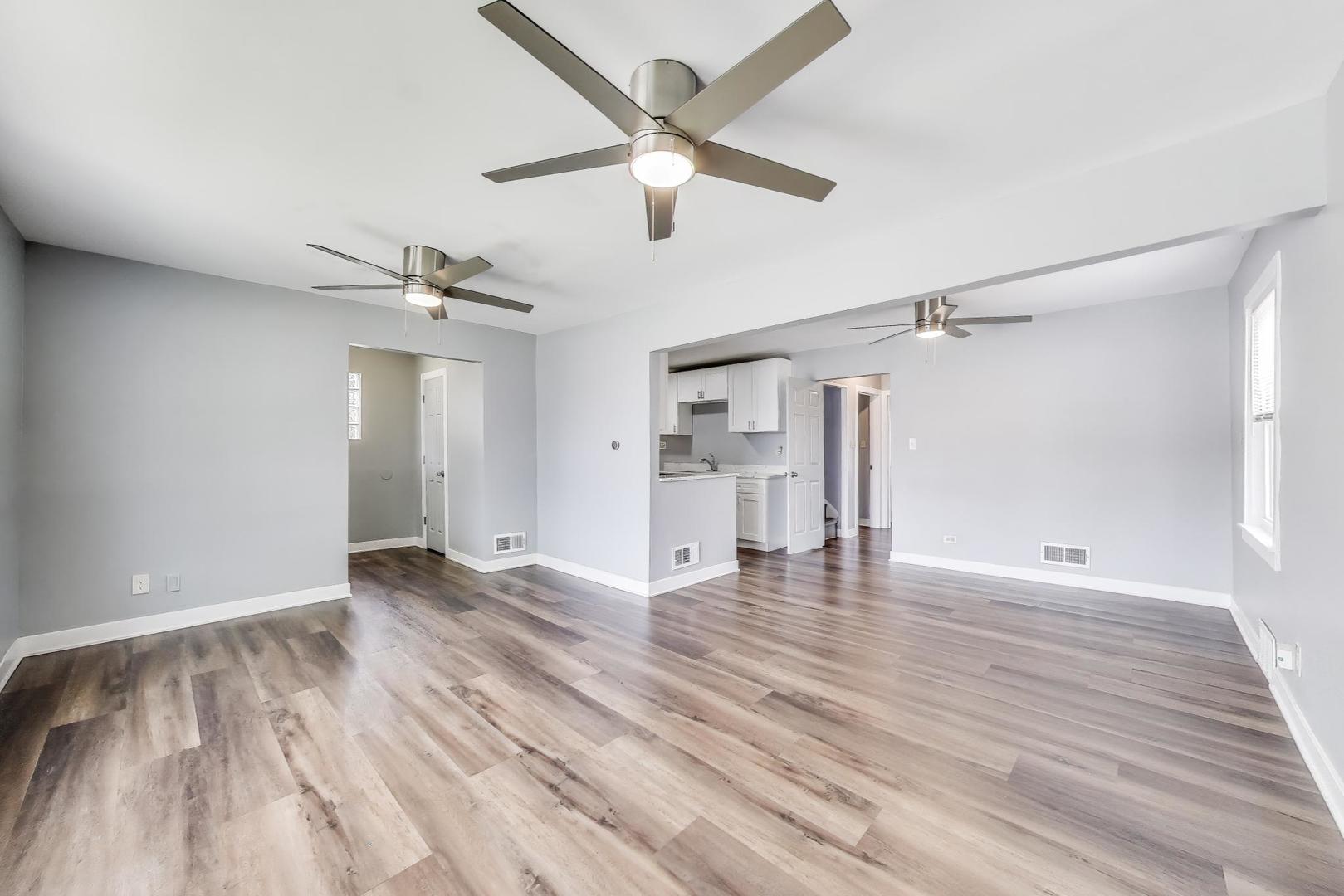 4118 Prairie Avenue Brookfield, IL 60513 - Photo 5 of 43 a view of empty room with wooden floor and ceiling fan