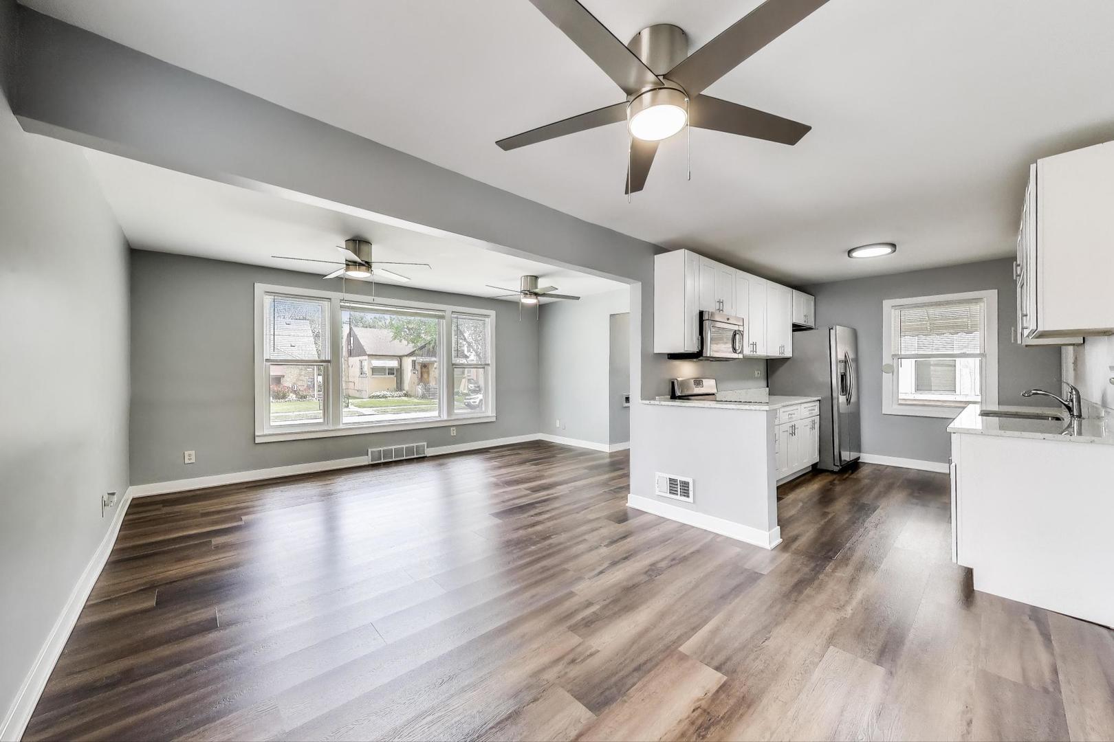 4118 Prairie Avenue Brookfield, IL 60513 - Photo 8 of 43 a view of kitchen with refrigerator stove microwave and cabinets