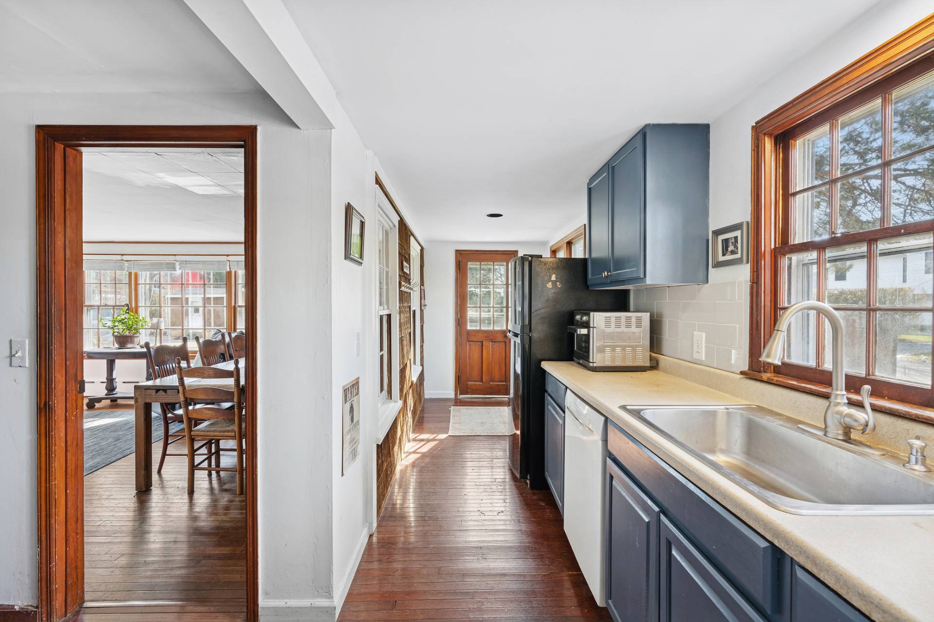 144 Sayre's Path Wainscott, NY 11975 - Photo 4 of 8 a kitchen with granite countertop a sink a counter top space and stainless steel appliances