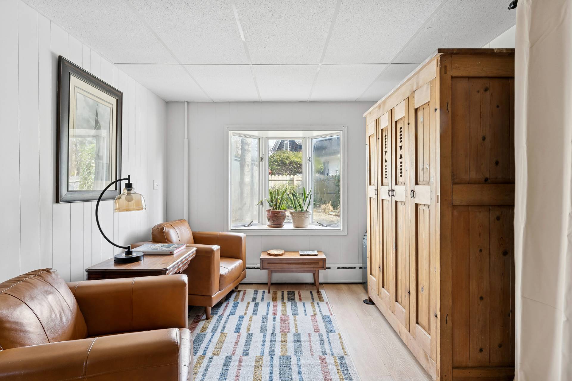 144 Sayre's Path Wainscott, NY 11975 - Photo 5 of 8 a living room with furniture and a window
