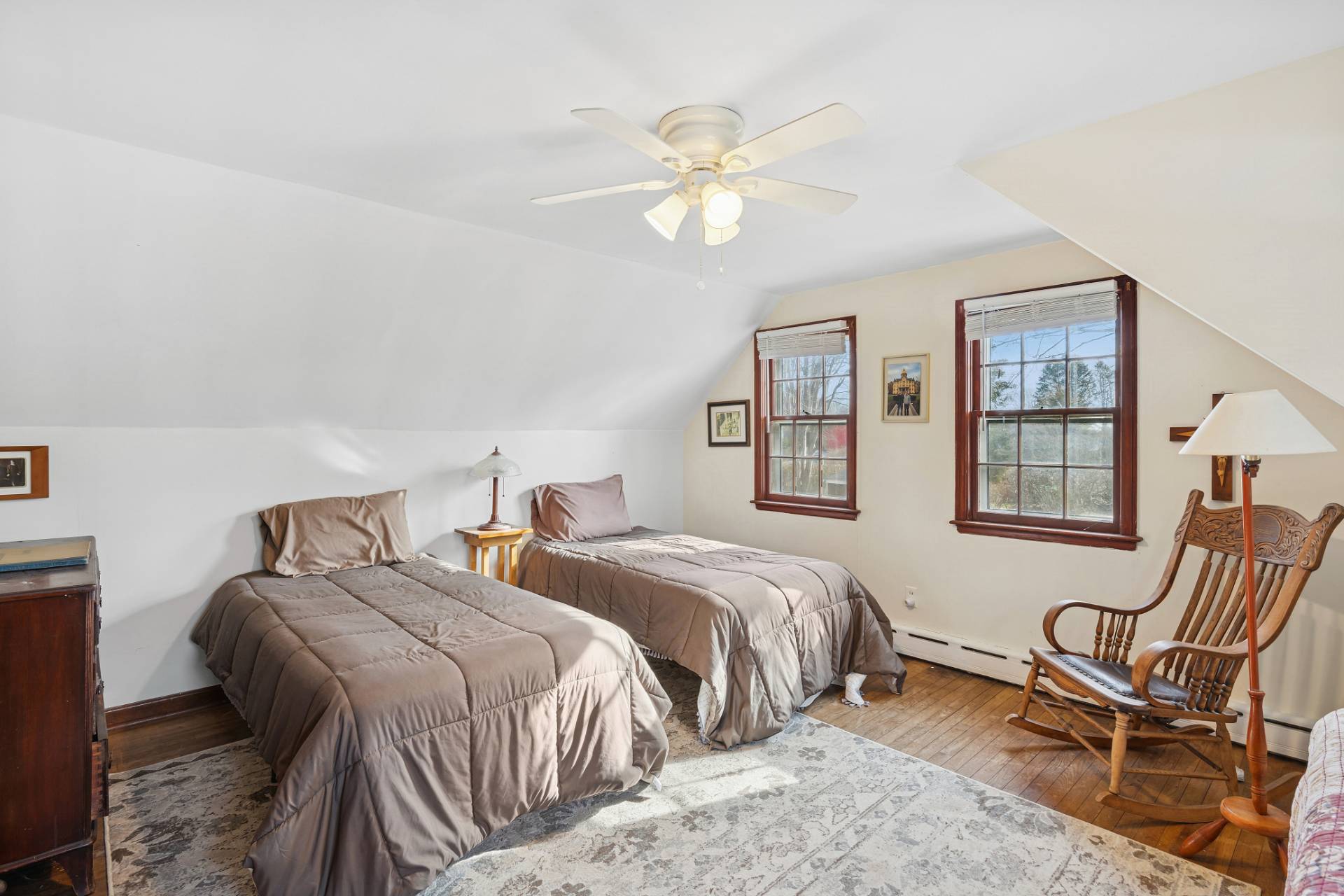 144 Sayre's Path Wainscott, NY 11975 - Photo 7 of 8 a bedroom with two beds and a chandelier