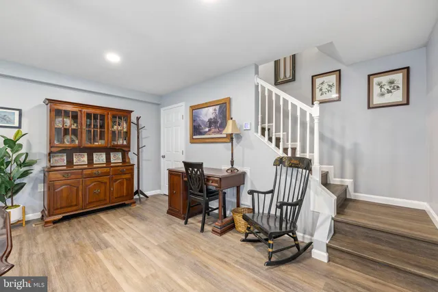 a dining room with furniture and wooden floor