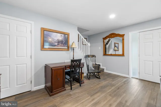 a bedroom with furniture and a window