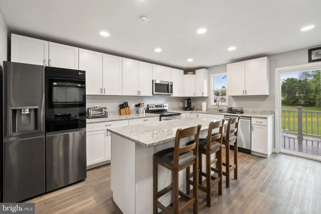 a view of a stove and washer in a room