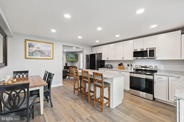 a view of deck with furniture and garden