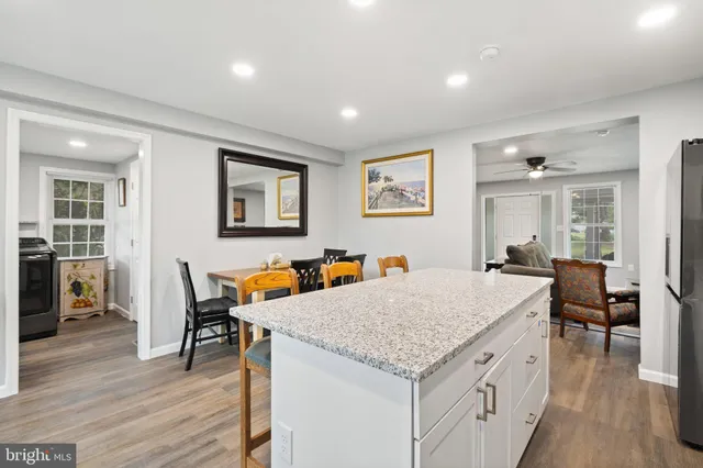 a view of balcony with a table and chairs