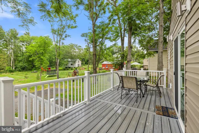 a view of a park with plants and a bench