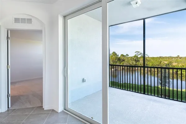 a view of a glass door and the balcony