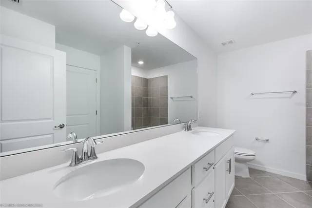 a bathroom with a sink and mirror