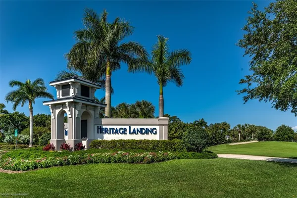 a view of a house with swimming pool and sitting area