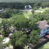 an aerial view of house with yard swimming pool and outdoor seating
