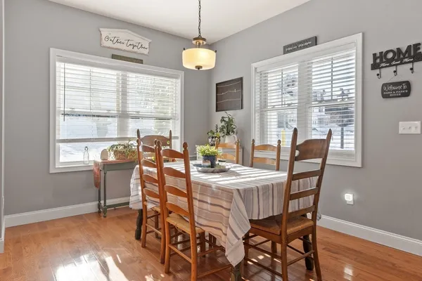 a view of a dining room with furniture window and outside view