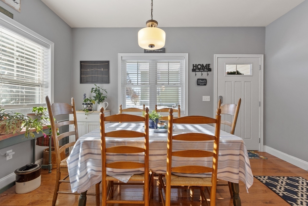 2 Eagle Nest Road, Unit B62 Clinton, MA 01510 - Photo 12 of 35 a view of a dining room with furniture and wooden floor