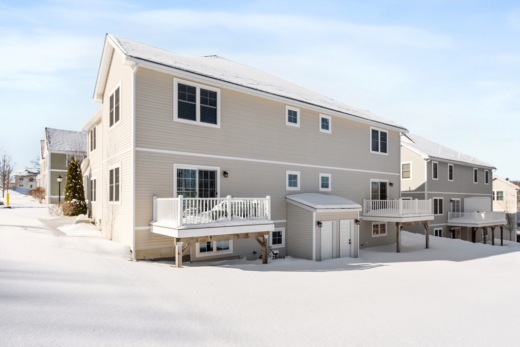 2 Eagle Nest Road, Unit B62 Clinton, MA 01510 - Photo 2 of 35 a large white building with pool table and chairs