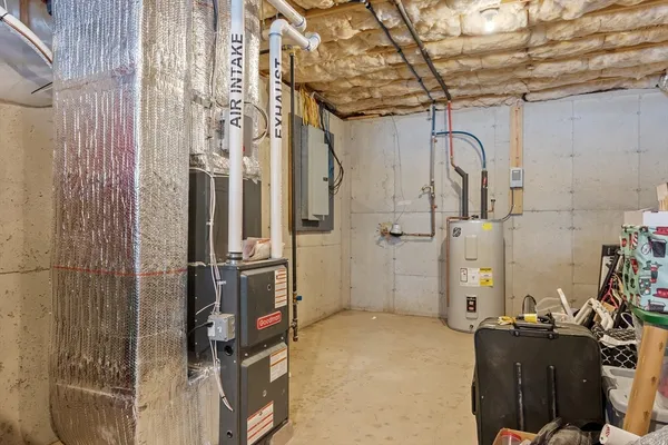 a utility room with sink dryer and washer