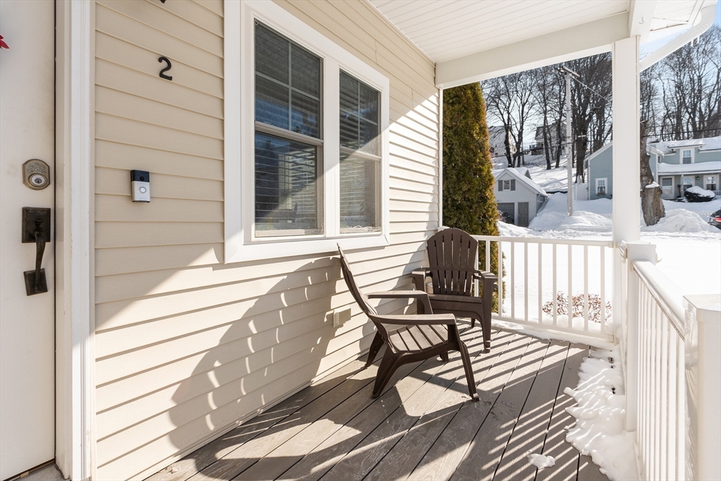 2 Eagle Nest Road, Unit B62 Clinton, MA 01510 - Photo 33 of 35 a view of a balcony with chairs and wooden floor