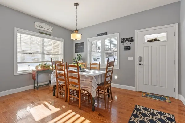 a view of a dining room with furniture window and outside view