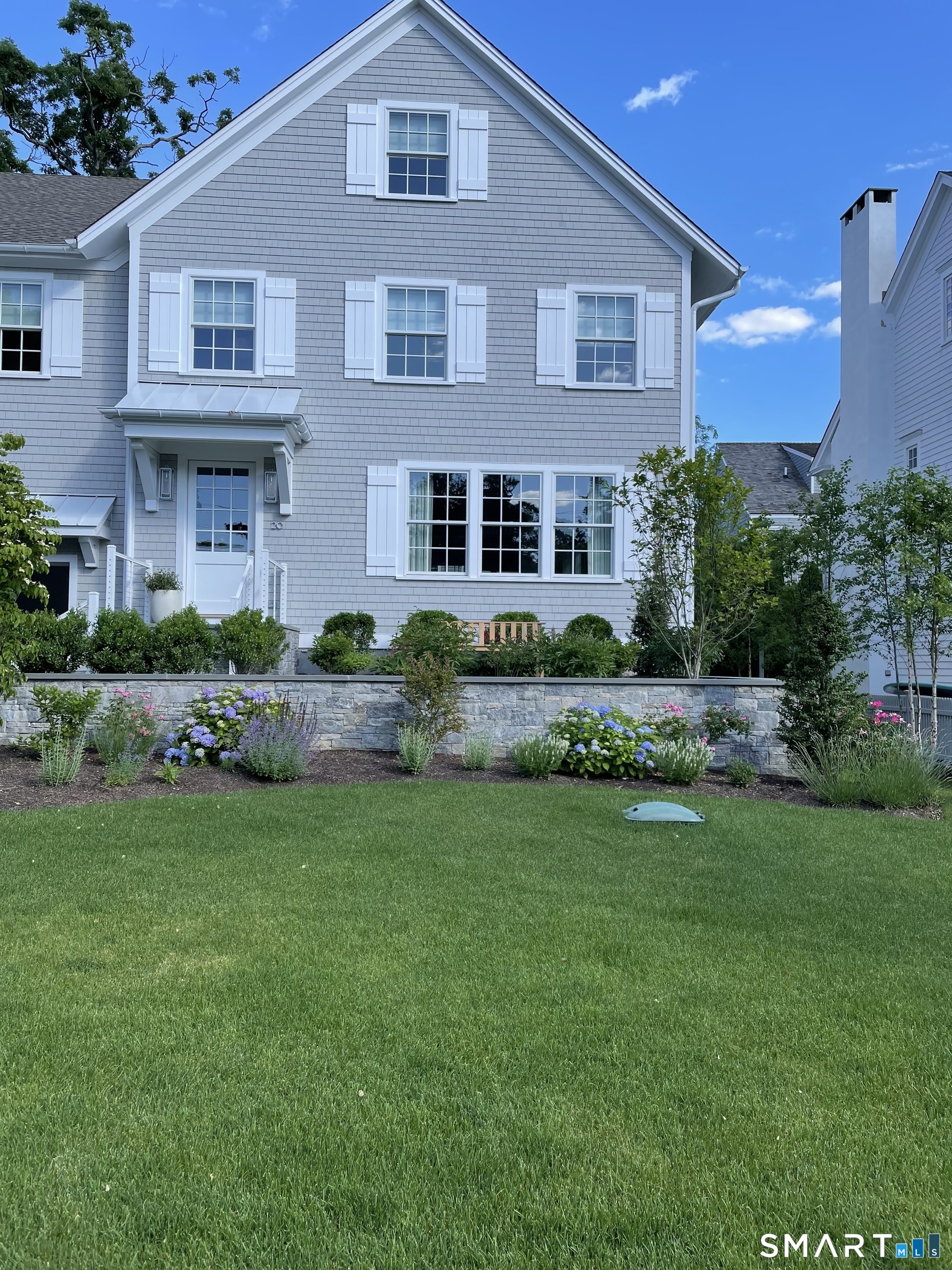 Undisclosed Address Norwalk, CT 06853 - Photo 1 of 1 a front view of a house with a yard