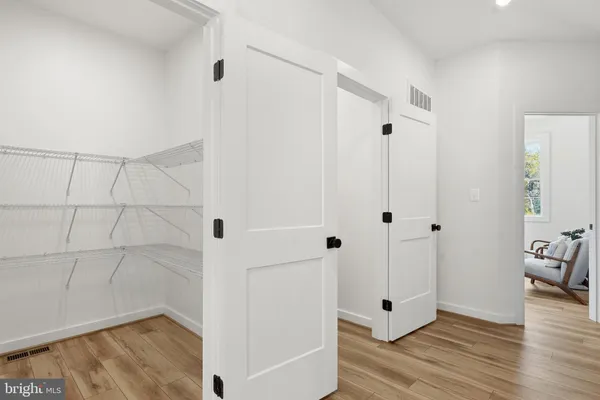 a view of a bathroom with wooden floor
