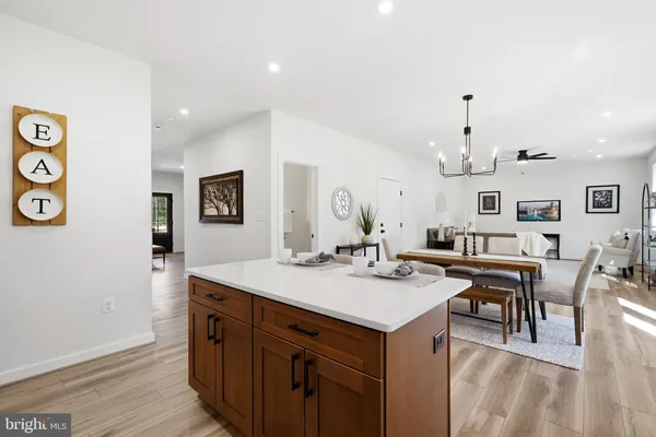 a view of a kitchen wooden cabinets and wooden floor