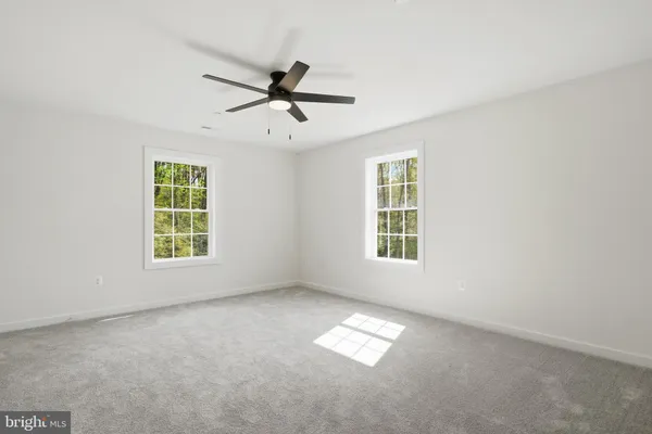 a view of empty room with windows