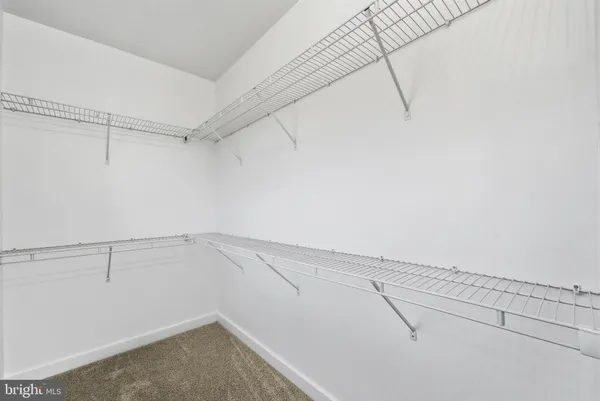 a view of a room with racks on the wall