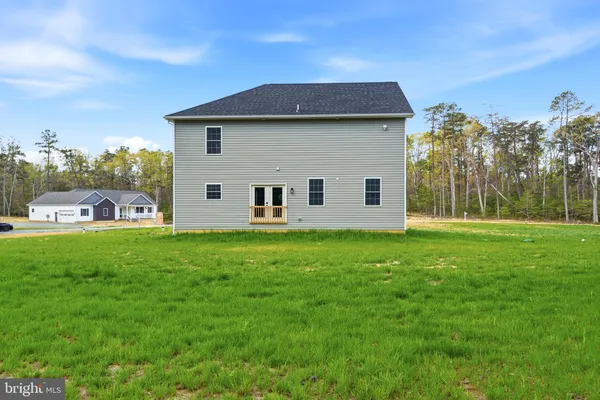 a view of a back yard of the house