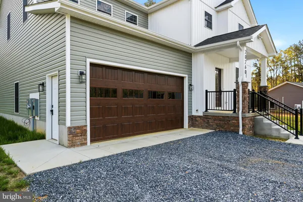 a view of a house with a garage