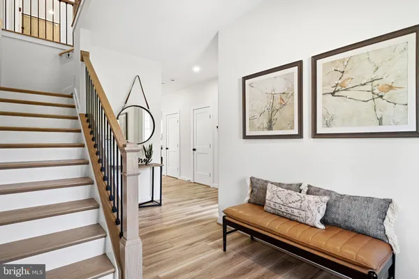 a living room with furniture and a stairs